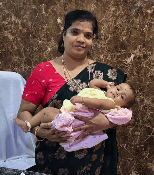 Dr. Sangeetha Balamurugan holding a baby at Skanda Fertility & Women's Health Centre